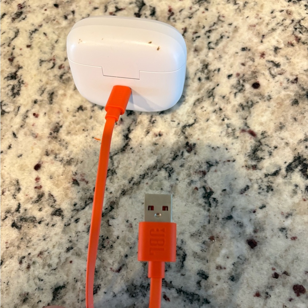 Orange USB Charging Cable with White Earbud Case